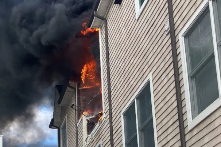 Photo Caption: Firefighters battle a second-alarm house fire at a three-story home on Leeward Avenue in Beach Haven Tuesday afternoon.