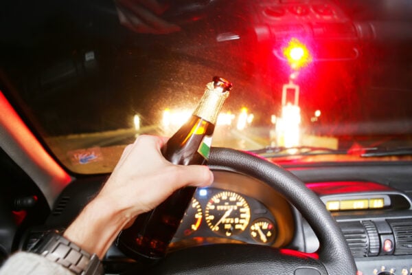 Drunk. Drinking beer whileDrunk. Drinking beer while driving car driving car. Photo by Ghubo Amin