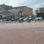 Photo caption: Nw parking spaces being striped at the former Lakewood Town Square, replacing much of the historic public gathering space near Clifton Avenue and 3rd Street.