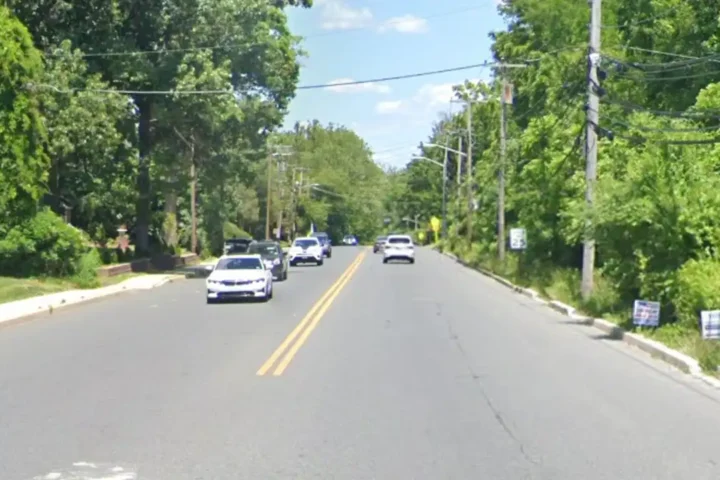 Police investigate the scene of a fatal crash on Laurel Road in Lindenwold where an e-bike rider was killed and the driver was arrested on death by auto and DUI charges.