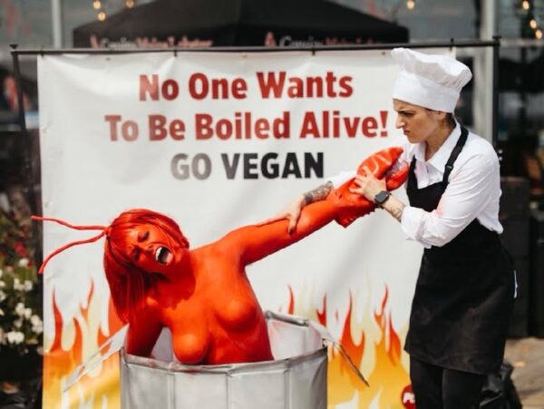 PETA staged a dramatic protest outside Cousins Maine Lobster in Asbury Park on Friday, using a body-painted "human lobster" to protest the practice of boiling lobsters alive and encourage diners to choose vegan alternatives.