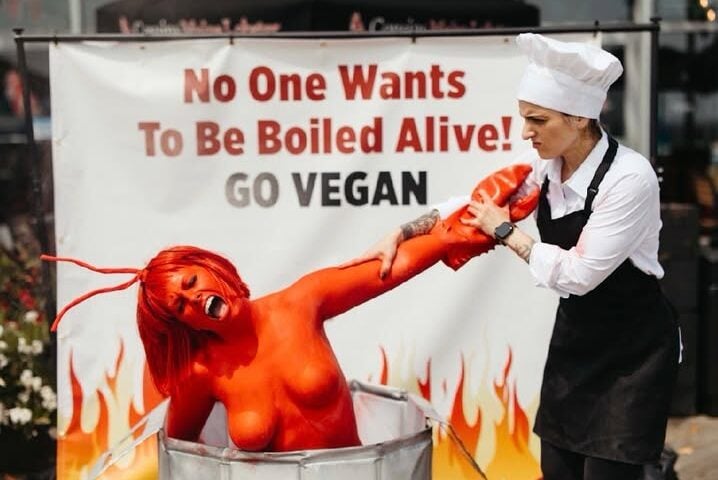 PETA staged a dramatic protest outside Cousins Maine Lobster in Asbury Park on Friday, using a body-painted "human lobster" to protest the practice of boiling lobsters alive and encourage diners to choose vegan alternatives.