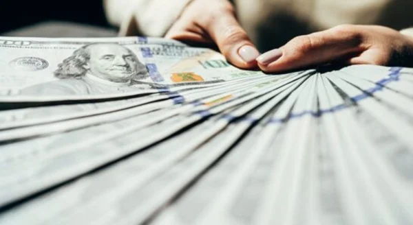 Woman holding hundreds of dollars from US lottery Winning