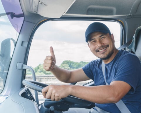 Professional Truck Driver Driving Tractor Trailer