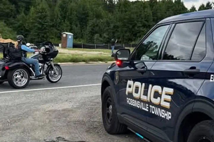 Photo Caption: Officers from the Robbinsville Township Police Department stand with participants in the America's 9/11 Remembrance Ride as the tribute event passed through Robbinsville on Saturday. Photo by Robbinsville Police Dept./Facebook