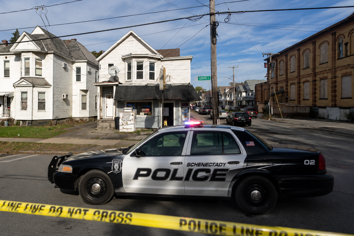 Schenectady police arrested Isaac A. Holmes after a foot chase, saying officers recovered cocaine and a loaded firearm from the 45-year-old suspect. Photo illustration by SNN