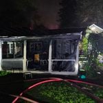 A North Stamford house fire displaced three residents and their dog Monday after flames spread through the kitchen, family room and attic before crews stopped it.