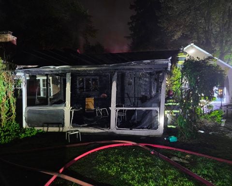 A North Stamford house fire displaced three residents and their dog Monday after flames spread through the kitchen, family room and attic before crews stopped it.
