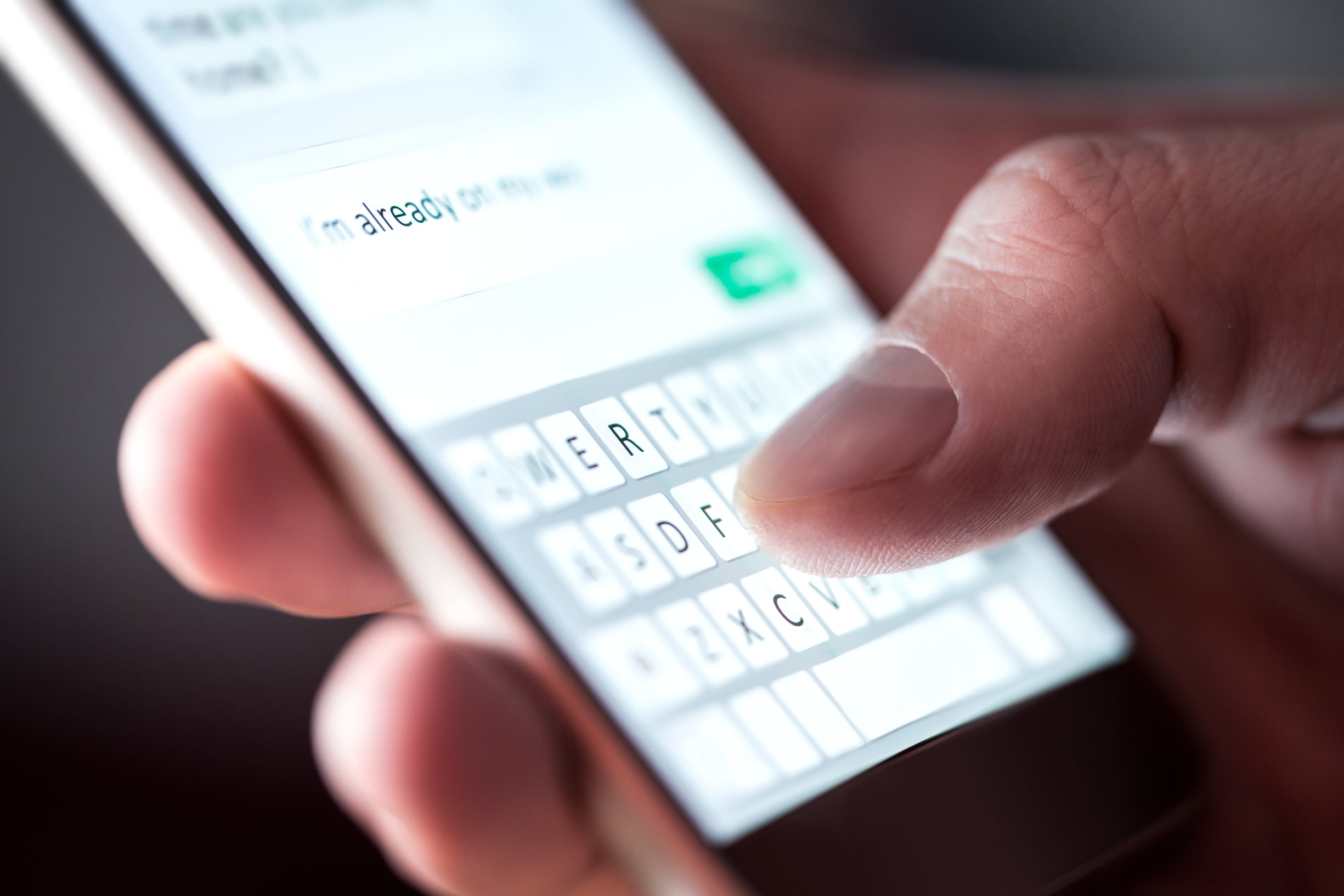 Man sending text on mobile phone - photo tero vesalainen