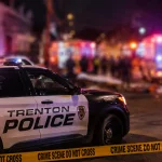 Photo Caption: Trenton police and Mercer County homicide detectives are investigating a Locust Street block party shooting that left two people dead and eight others wounded early Sunday.