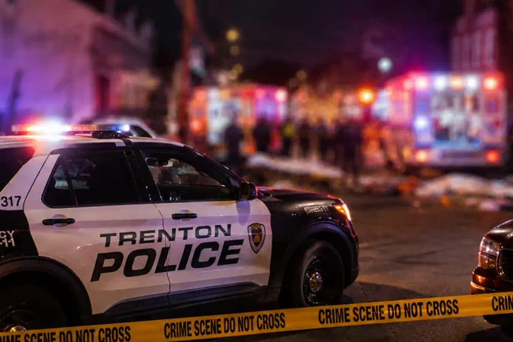 Photo Caption: Trenton police and Mercer County homicide detectives are investigating a Locust Street block party shooting that left two people dead and eight others wounded early Sunday.