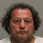 Investigators recovered firearms from a neighboring home after shots were fired into an occupied residence in Upper Saddle River, leading to the arrest of a 60-year-old man.
