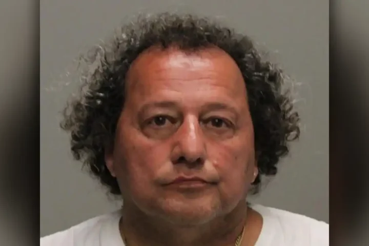 Investigators recovered firearms from a neighboring home after shots were fired into an occupied residence in Upper Saddle River, leading to the arrest of a 60-year-old man.