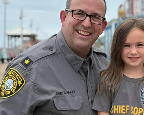 Photo Caption: Chief Sophia poses with members of the Seaside Park Police Department after spending the day serving as the department's first honorary "Chief of the Day." Photo by Seaside Park Police Dept. / Facebook