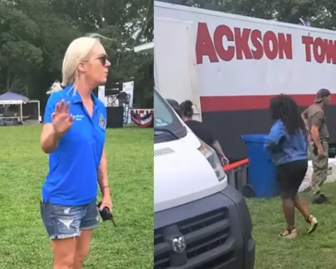 Photo Caption: Jackson Mayor Jennifer Kuhn speaks with an independent journalist during Jackson Day before requesting police assistance during a dispute over public records questions.