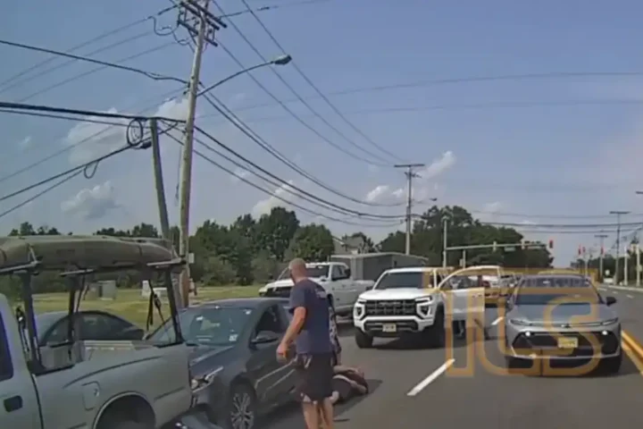 Dashcam video captured a violent road rage confrontation in Lakewood that left one driver unconscious and hospitalized while police arrested the alleged attacker at the scene.