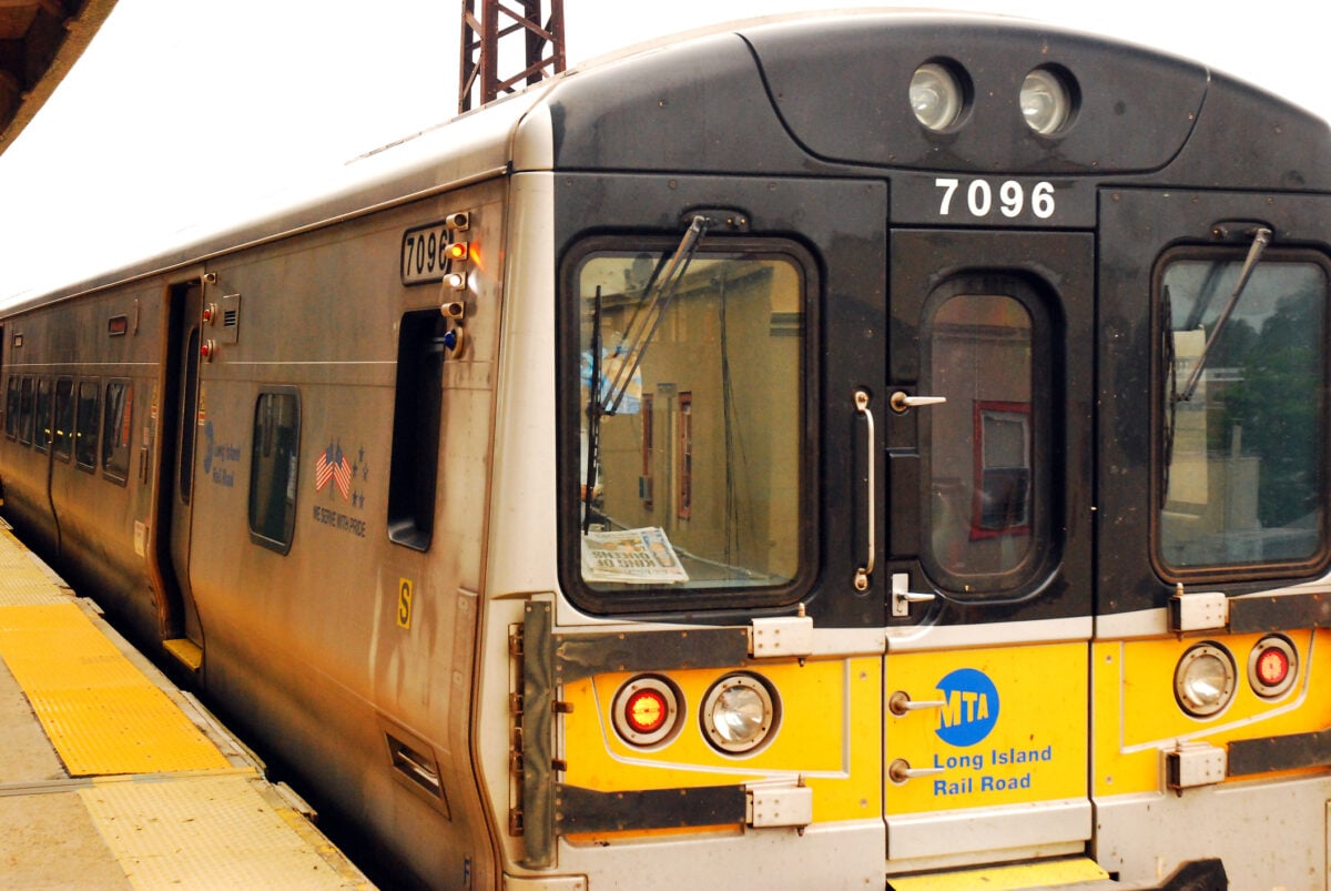 A Long Island Railroad train prepares to leave the station at Rockville Centre New York after closing its doors. Photo by James Kirkikis.
