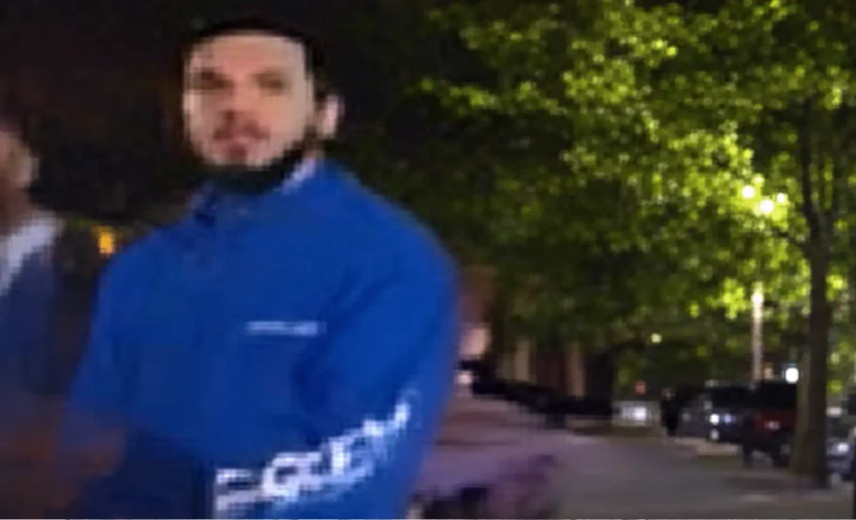 NYPD detectives are searching for a suspect who threw a glass bottle at an on-duty officer in Queens, striking him in the head and causing a laceration.