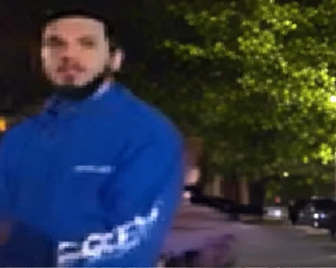NYPD detectives are searching for a suspect who threw a glass bottle at an on-duty officer in Queens, striking him in the head and causing a laceration.