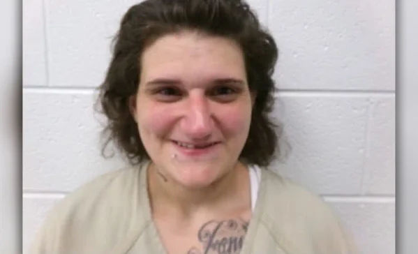 A cumberland woman is being held without bond on arson and explosives charges after investigators said she intentionally set a july porch fire.