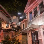 Three-alarm queens house fire injures 3 firefighters as flames spread to adjoining home