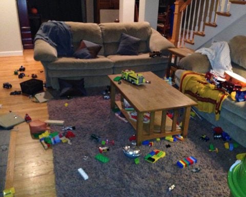 Messy Living room. A living room with with toys and clothes all over the place. Photo by Carrie Seufer.