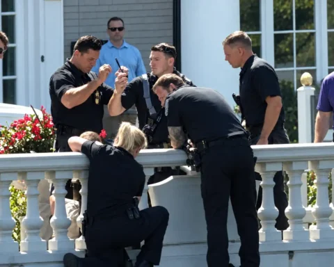Westfield police officers rescue child trapped between two columns. Photo enhanced for clarity. Original photo in article
