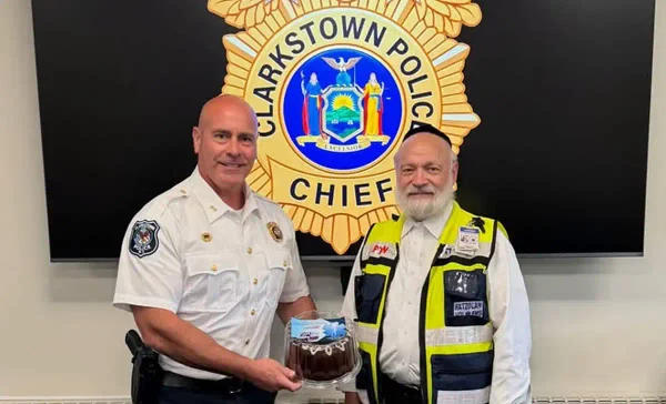 Clarkstown Police Chief Jeffrey Fay meets with RC Hatzoloh representative Abe Rosenberg ahead of Yom Kippur. Photo courtesy Clarkstown Police Department.