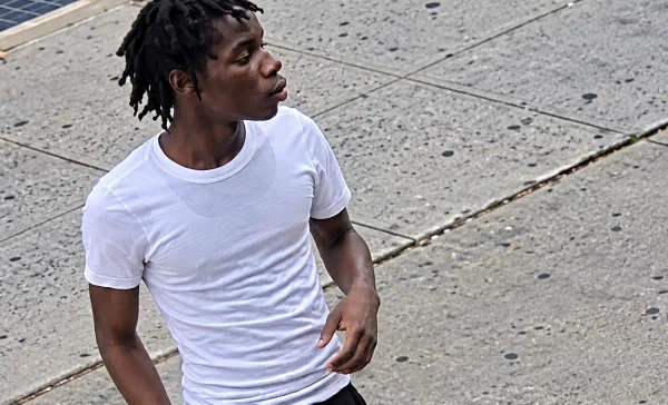 The nypd is searching for a man accused of stabbing two 15-year-old boys during a confrontation on fulton street in brooklyn.