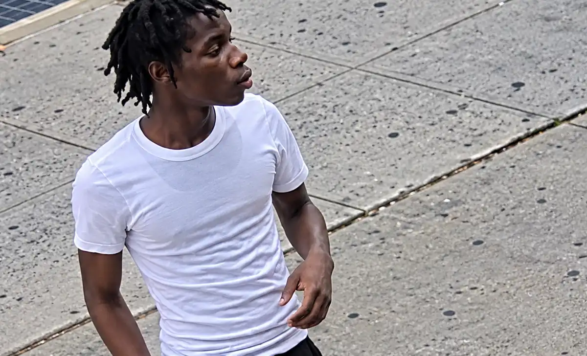 The NYPD is searching for a man accused of stabbing two 15-year-old boys during a confrontation on Fulton Street in Brooklyn.