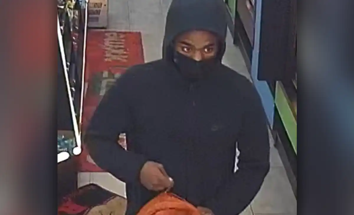 The NYPD is searching for a gunman accused of stealing approximately $2,000 from a Manhattan business before fleeing into the West 4th Street subway station.