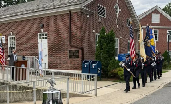 Teaneck police, firefighters, ems volunteers and public works employees joined residents to commemorate the 25th anniversary of the sept. 11 attacks.