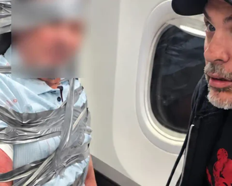 Two Gun For Hire representatives helped restrain a violent passenger on a Newark-bound American Airlines flight before it diverted to Baltimore.