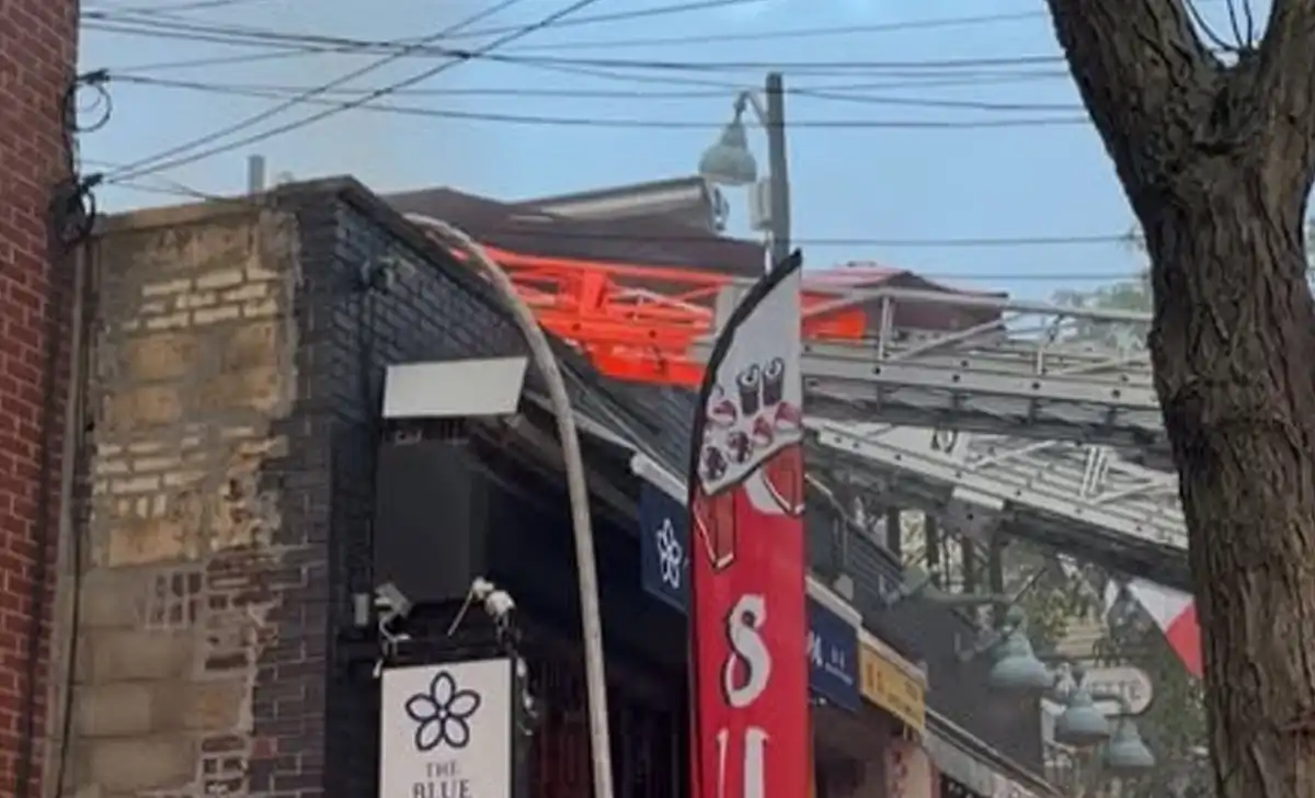 FDNY firefighters battle a four-alarm restaurant fire on North 5th Street in Brooklyn that injured six firefighters and prompted a mayday after a smoke explosion.
