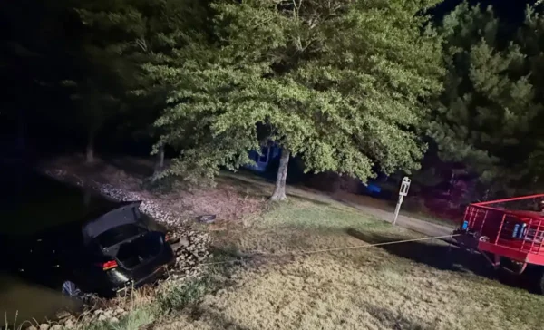 Manchester police officers rescued a driver before a vehicle became completely submerged in a body of water inside the renaissance development early sunday.