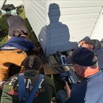Long island firefighters use jaws of life to rescue dog trapped beneath backyard shed