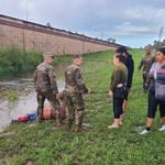 Florida national guard soldiers swim to submerged vehicle to rescue occupants after hurricane isaias