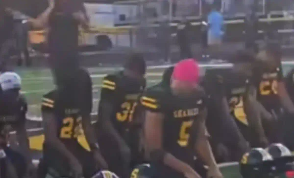 Members of the malcolm x shabazz high school football team gather for salah before kickoff in newark.