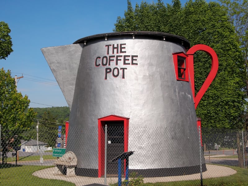The historic 18-foot-tall coffee pot stands near the bedford county fairgrounds in pennsylvania, where the unusual roadside landmark has attracted motorists since 1927.