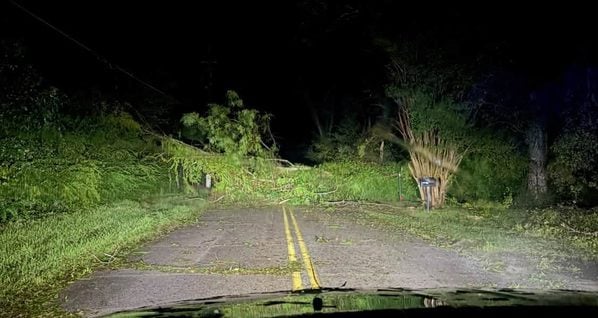 Destin faces hurricane damage, blocked roads and power outages as officials warn residents to conserve water to prevent sewage backups during recovery.