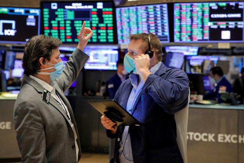 World stocks fall on central banks' inflation outlooks, glum Facebook update