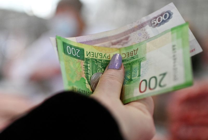 Isolated Russians scramble for hard currency, fear worse is yet to come