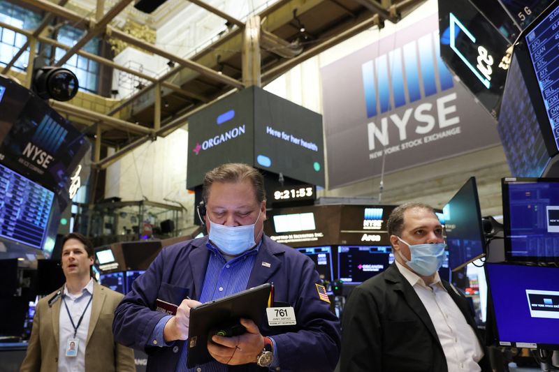 Wall St slides as oil prices surge, Nasdaq confirms bear market