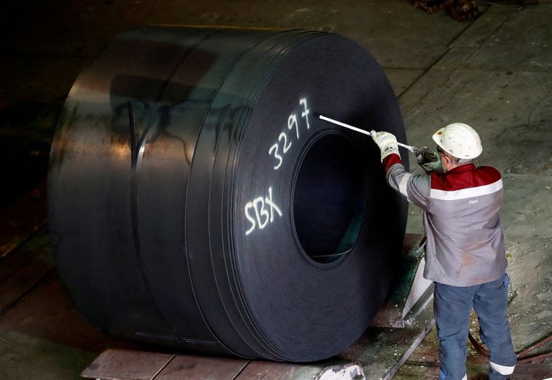 Backlogs, more staff help German factories against headwinds -PMI
