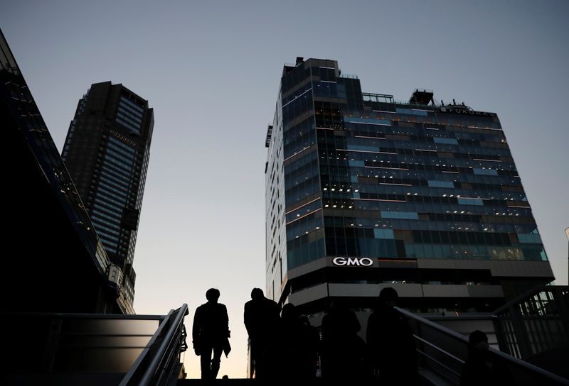 Japan business mood subdued on chip shortage, raw material costs - Reuters Tankan