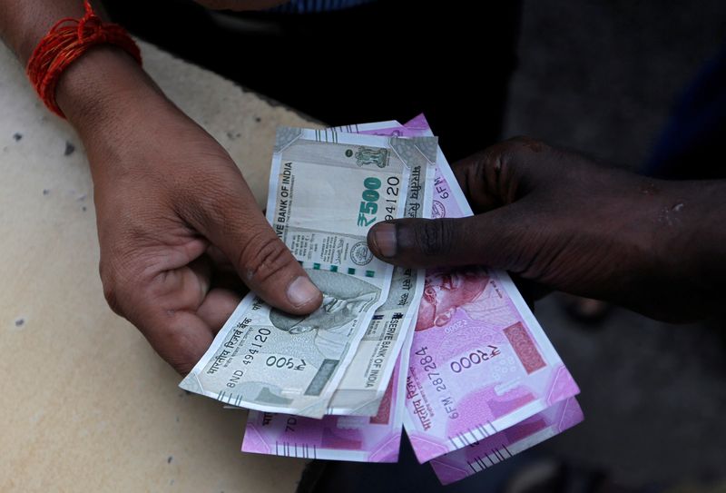 Indian rupee at over 1-wk high on broad $ losses; bond yields slip