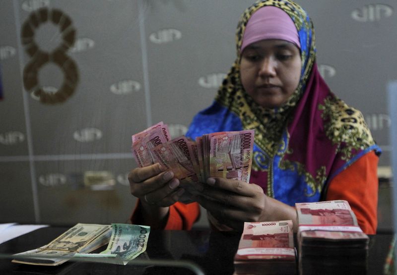 Analysis-Hint of a Fed pause opens door to Asia's emerging markets