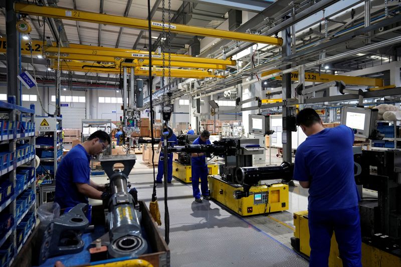 China steps up easing, cuts lending benchmarks to revive faltering economy