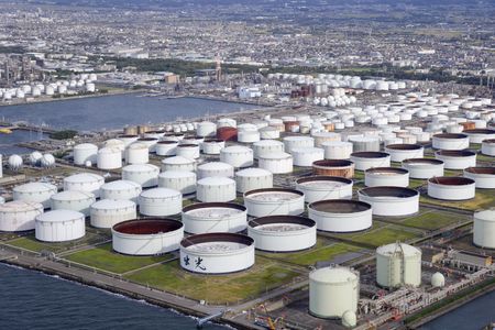 Analysis-Lower oil prices defy robust forecasts for global demand