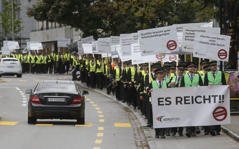 Swiss airline pilots march on HQ to press contract demands